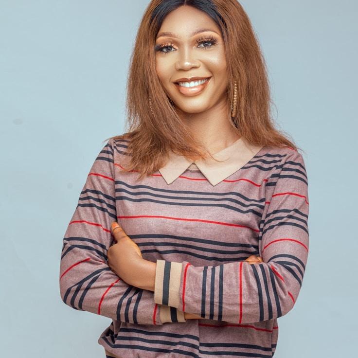 Alex Morgan, Lead Design Curator at HarvestCrestNovel, reviewing corporate floral arrangements